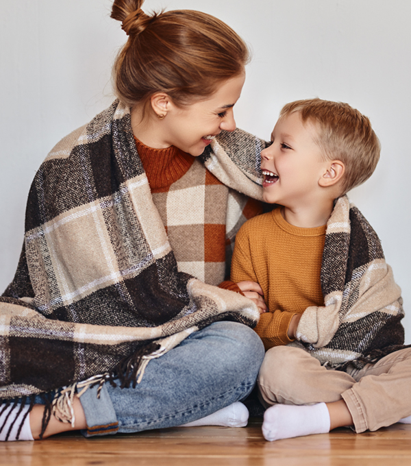 Stock Photo - Mother and son with blanket around shoulders