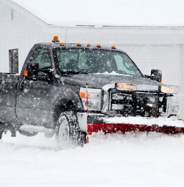 Stock Photo - Truck plowing snow from driveway